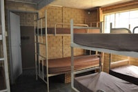 a group of bunk beds in a room